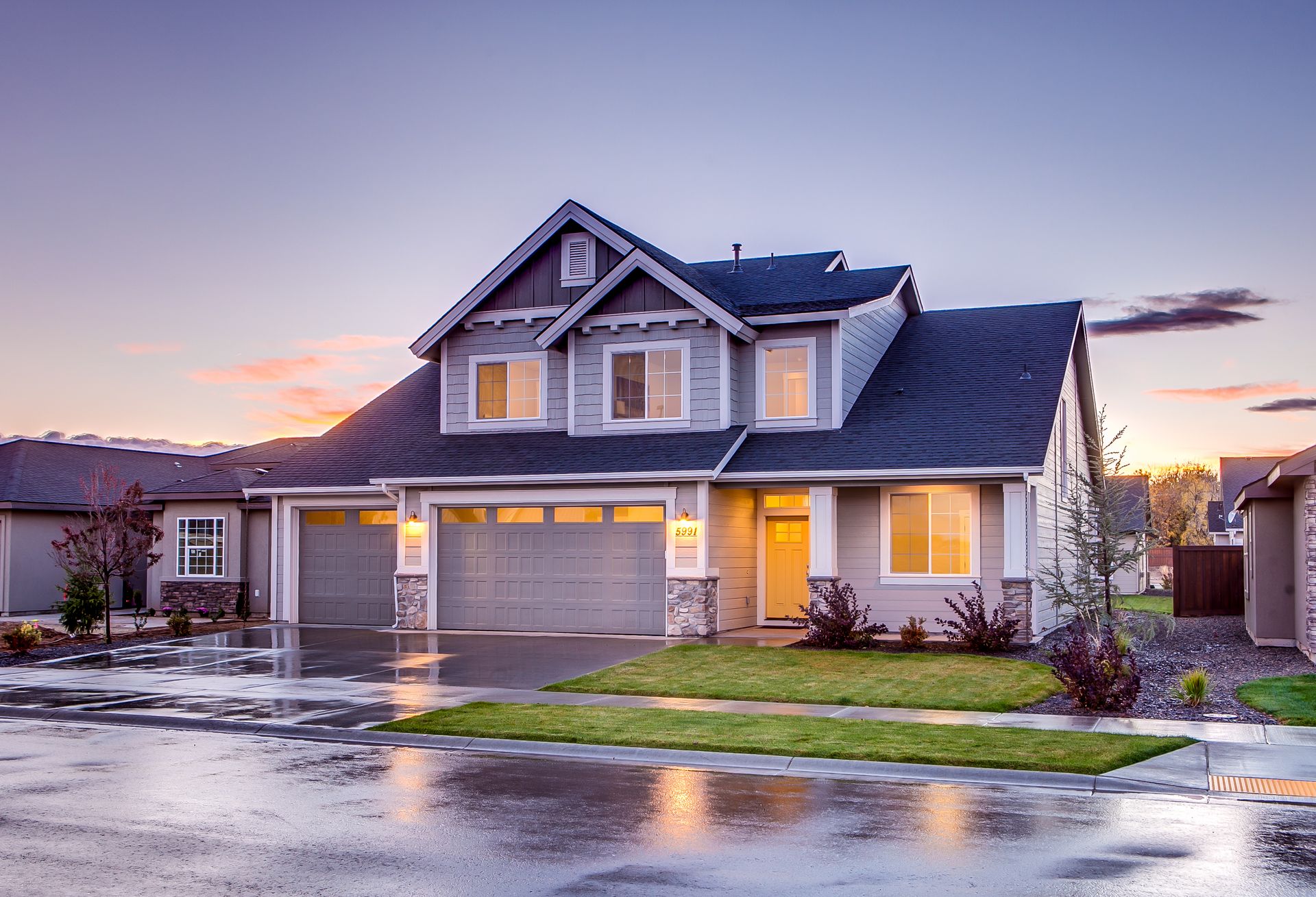 A well kept single family rental home with a trimmed lawn under a clear sky, the kind of investment property a cost segregation study is built for